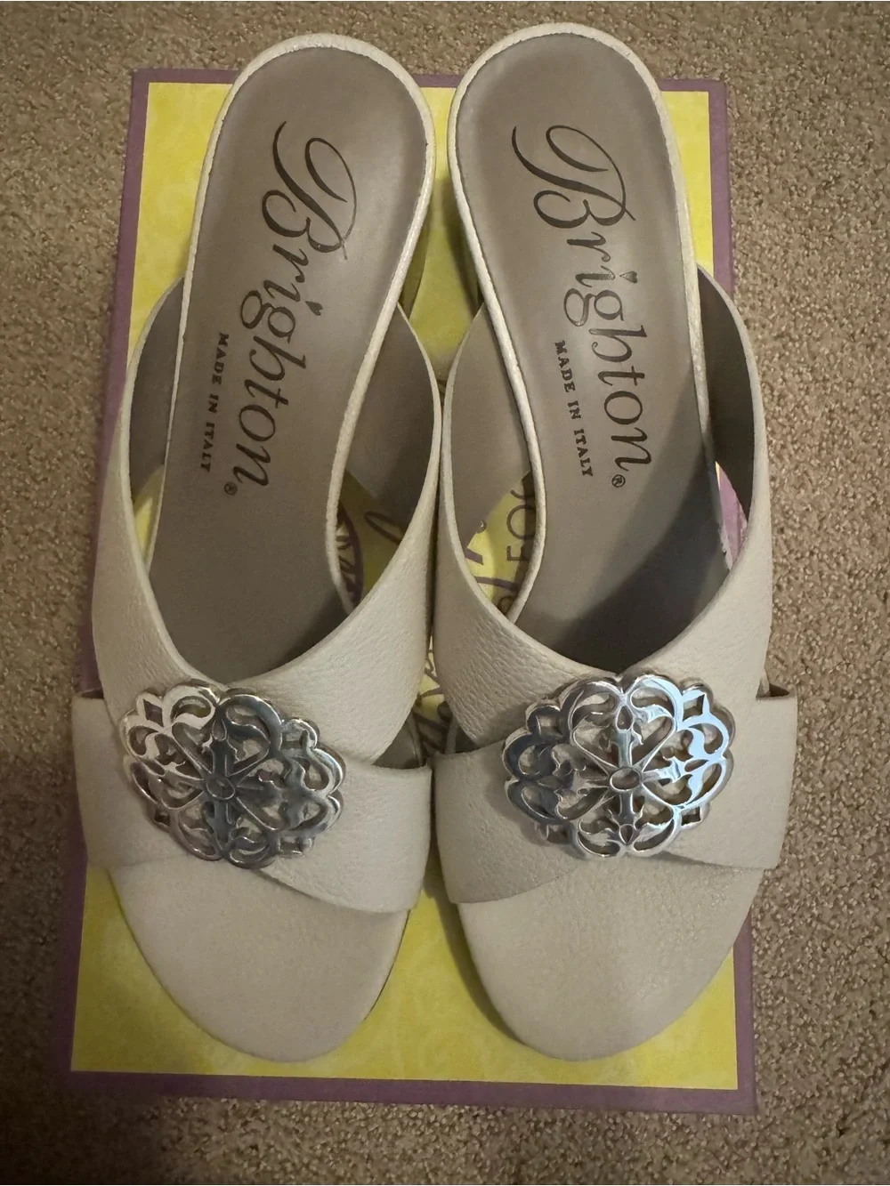 Brighton Cream Slide Mules with Silver Floral Medallion